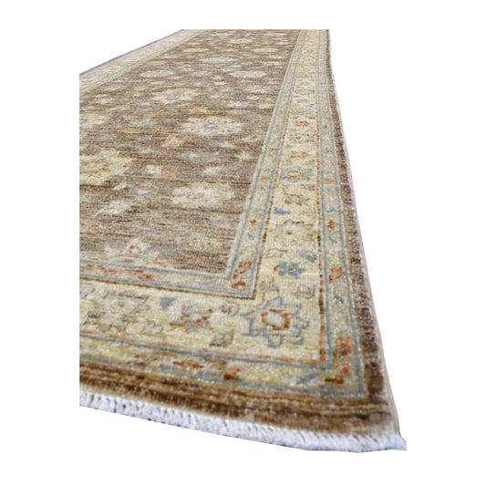 Angled view of Chobi runner showing its taupe floral field, ivory border with dusty blue and rust details, and white fringe