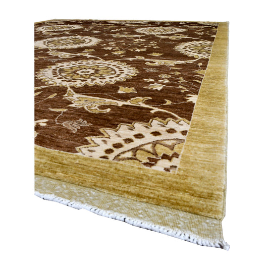 Angled view of Afghan Chobi rug showing its brown medallion field, broad muted-gold border and white fringe
