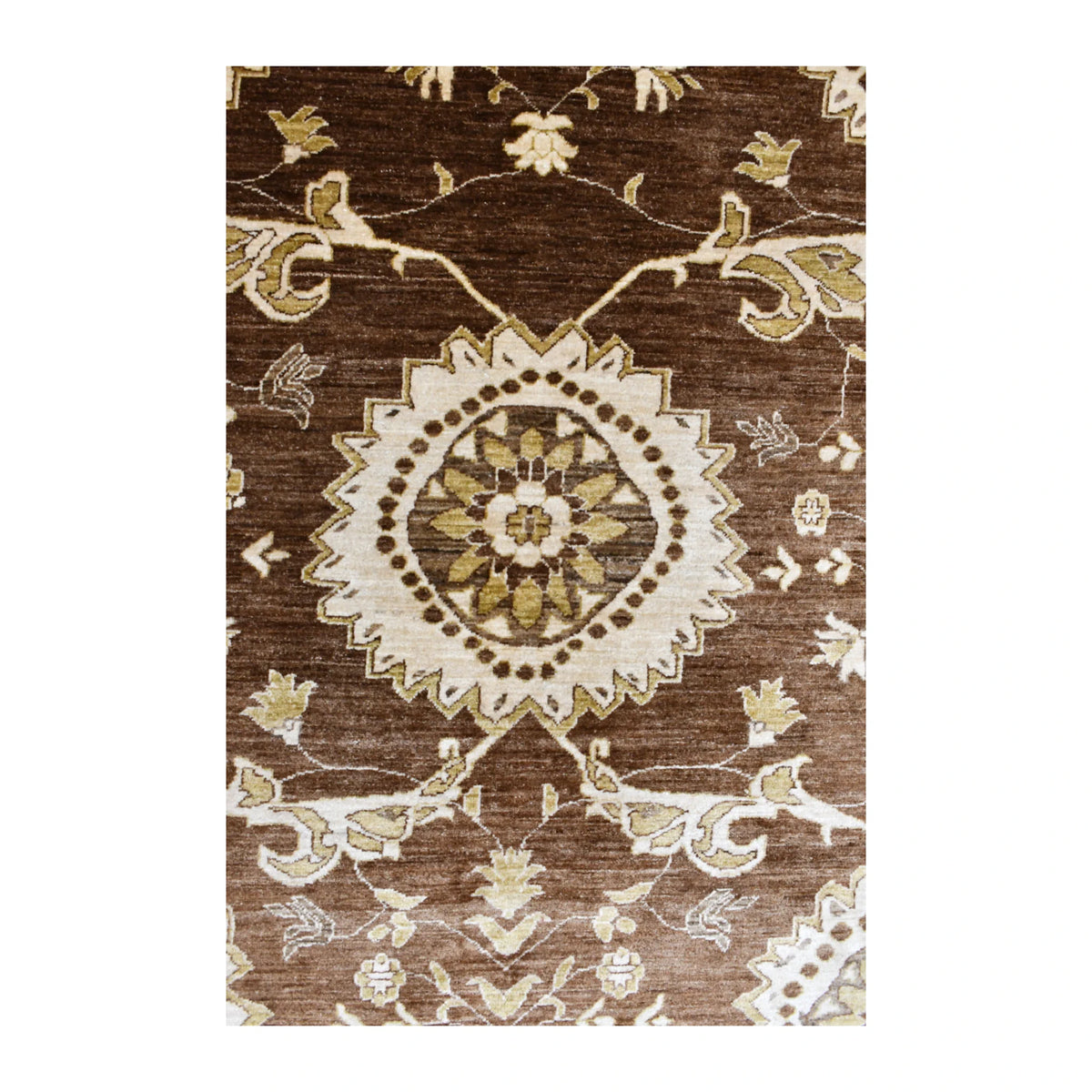 Detail of an ivory floral medallion surrounded by palmettes, blossoms and winding vines on the brown Chobi rug