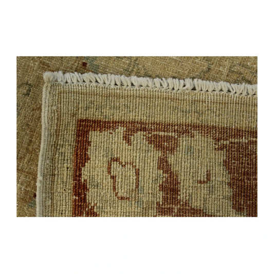 Border detail of Afghan Chobi gold floral rug showing red wool pattern and fringe