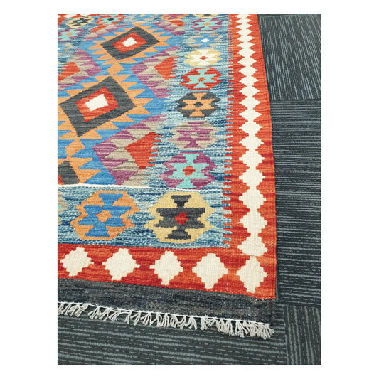 Angled detail of Afghan Chobi Kilim showing fringe, border pattern, and handwoven geometric motifs, 123 x 90 cm