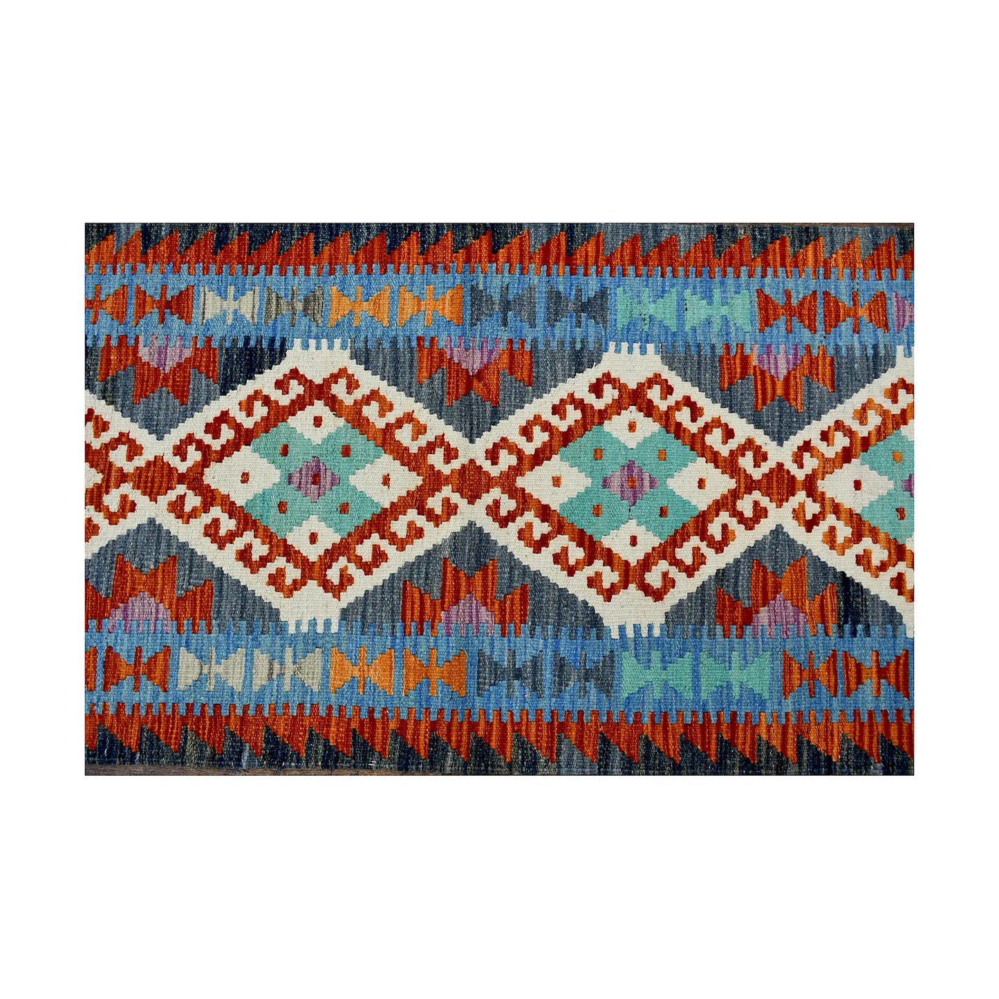 Centre pattern detail of Afghan Chobi Kilim runner showing repeating ivory diamonds on blue and rust geometric field