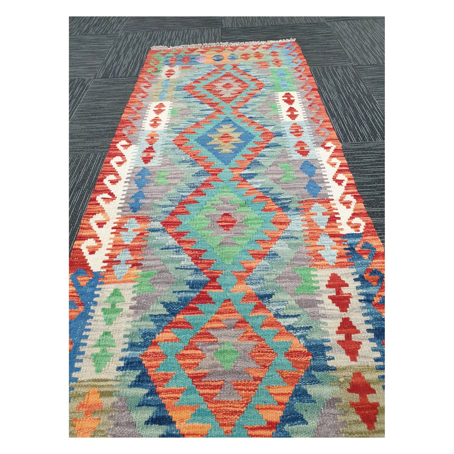Close runner view of Afghan Chobi Kilim handwoven flatweave with elongated linked medallion design, 207 x 65 cm
