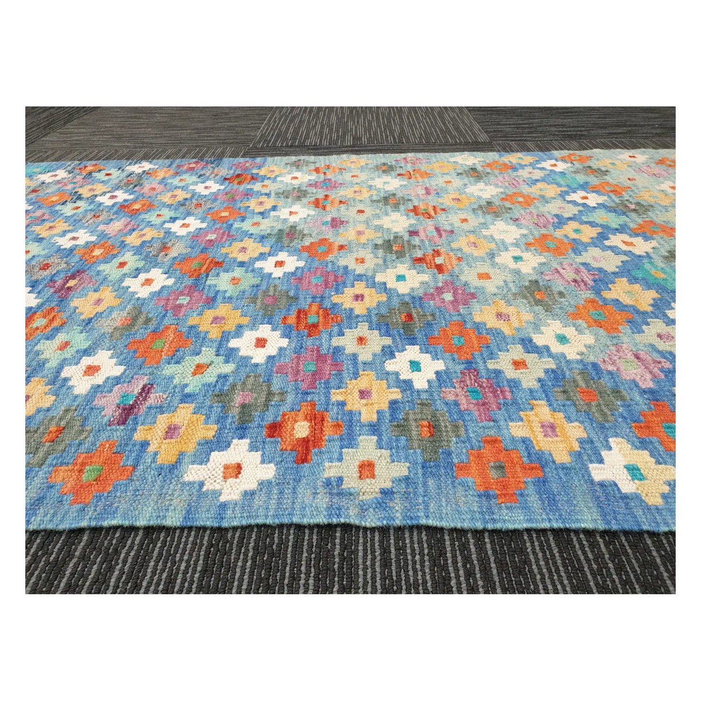 Low-angle close-up of Afghan Chobi Kilim wool flatweave texture and multicolour geometric pattern, 303 x 80 cm