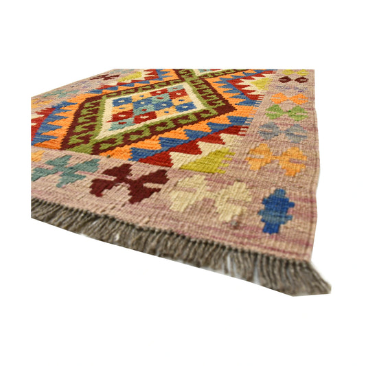 Angled fringe and flatweave detail of Afghan Chobi Kilim wool rug showing beige, rust, teal and olive geometric pattern