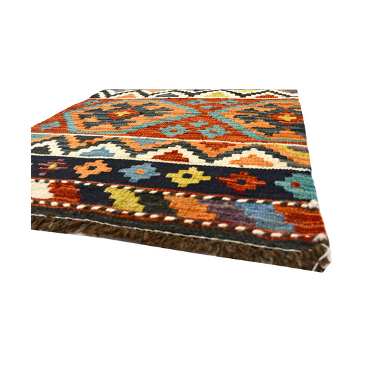 Angled fringe and flatweave detail of Afghan Chobi Kilim wool rug showing sky blue, rust, mustard and black geometric bands