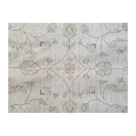 Field detail of Afghan Chobi soft beige rug showing subtle floral motifs