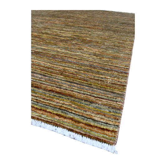 Angled view of Afghan Gabbeh wool rug showing finely layered olive, beige, rust and muted blue tones with pale fringe