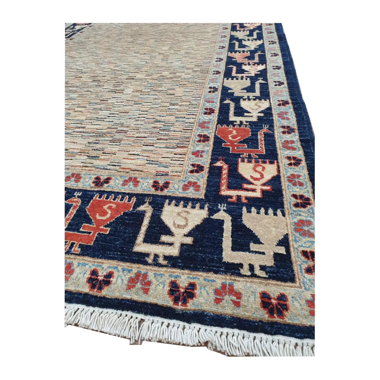Opposite corner detail of Afghan Gabbeh rug showing the deep navy border, ivory and terracotta motifs and visible fringe