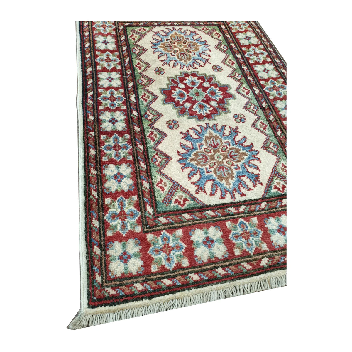 Close-up of Afghan Kazak wool rug showing red blue border detail, fringe edge and hand-knotted pile texture, 88 x 58 cm