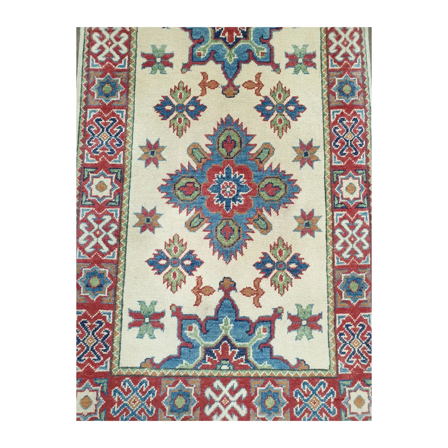 Geometric medallion detail on Afghan Kazak hand-knotted wool runner rug