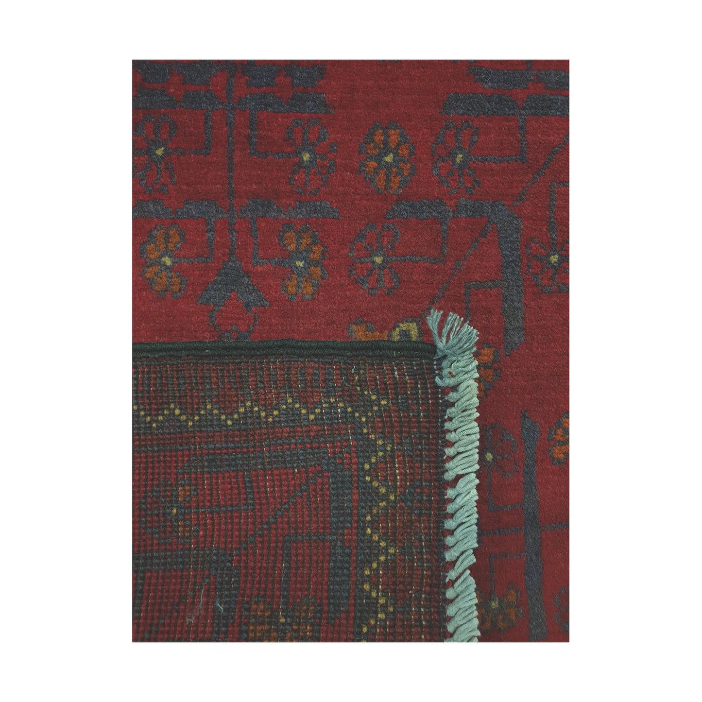 Folded corner reverse-weave detail of Afghan Khal Mohammadi hand-knotted wool rug showing back structure, border pattern, fringe and weave