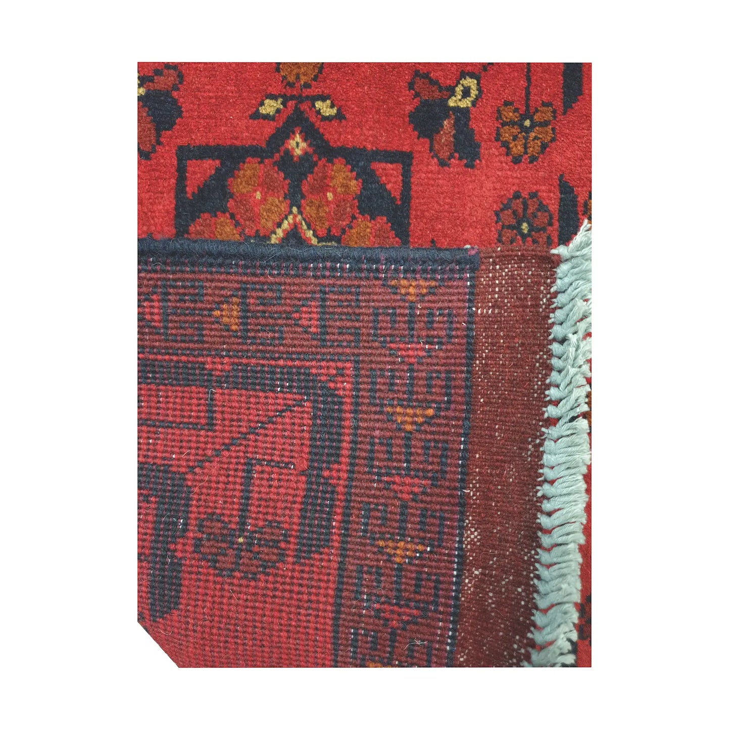 Folded corner reverse-weave detail of Afghan Khal Mohammadi hand-knotted wool rug showing back structure, red field, fringe and weave