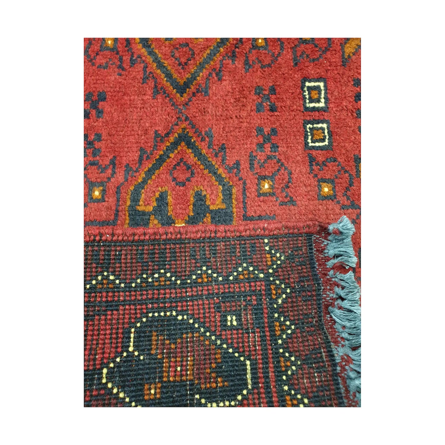 Folded corner reverse-weave detail of Afghan Khal Mohammadi hand-knotted wool rug showing back structure, border pattern, fringe and weave