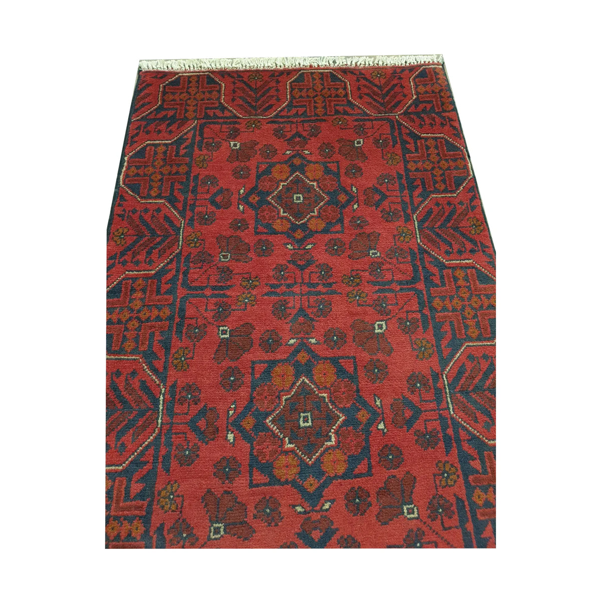 Close-up of Afghan Khal Mohammadi rug showing red geometric pattern and fringe detail