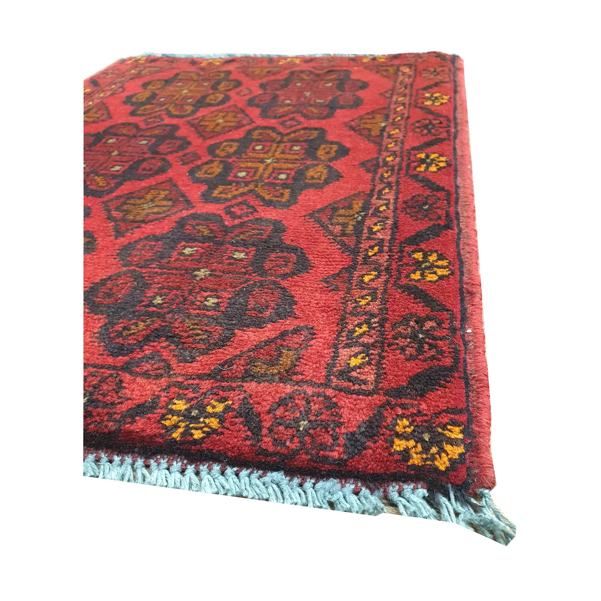 Fringe and border detail of Afghan Khal Mohammadi wool rug showing red field, dark edging and small tribal motifs