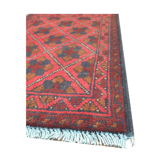 Fringe and border detail of Afghan Khal Mohammadi wool rug showing red field and dark geometric edging