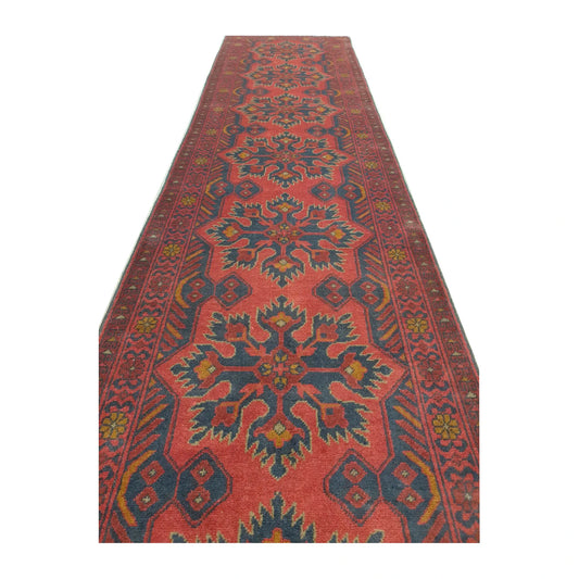 Angled pattern detail of Afghan Khal Mohammadi wool runner rug showing rust-red field, dark navy outlines and muted blue motifs, 385 x 80 cm
