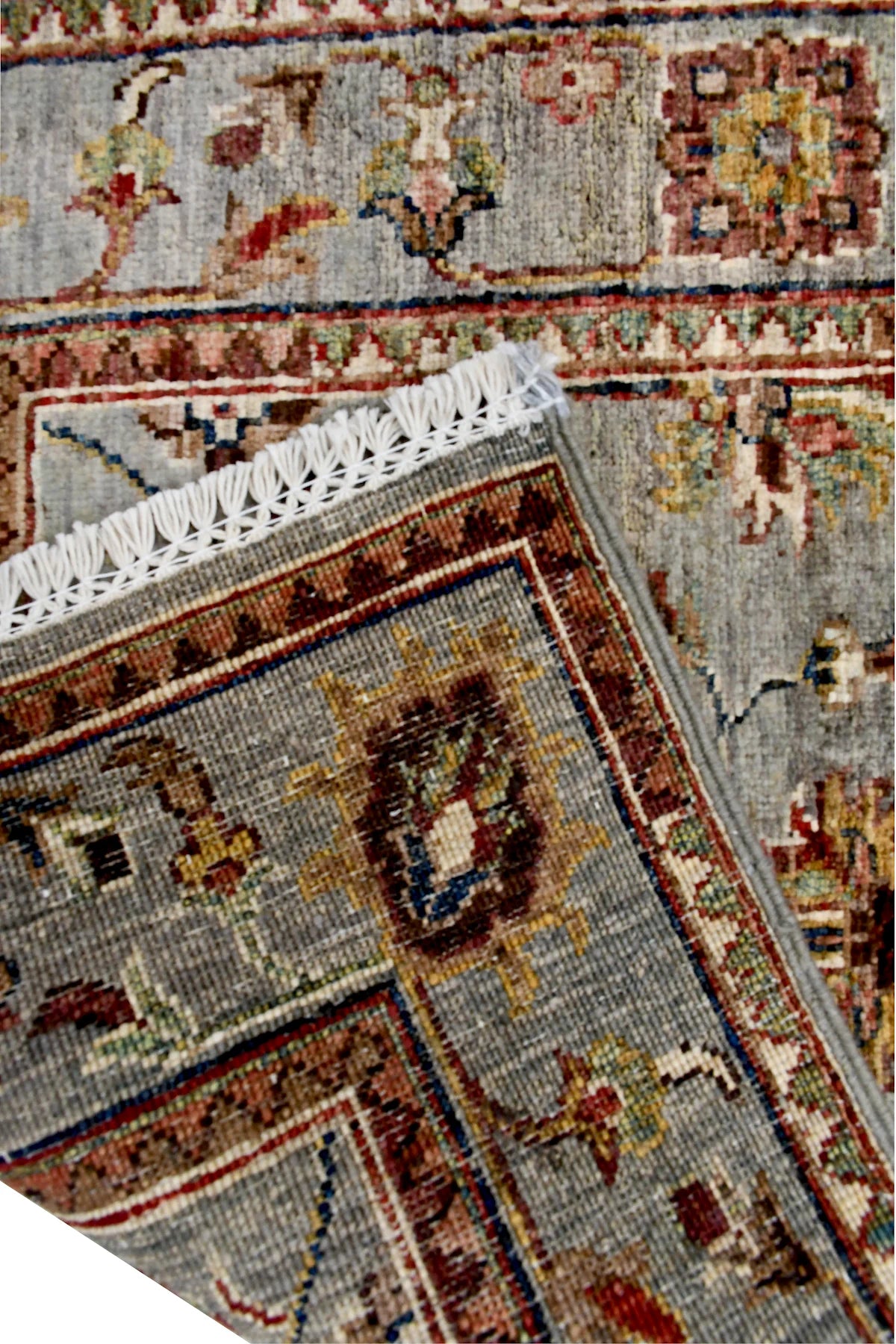 Folded corner reverse-weave detail of Afghan Sultani hand-knotted wool runner rug showing the back structure, pattern and weave