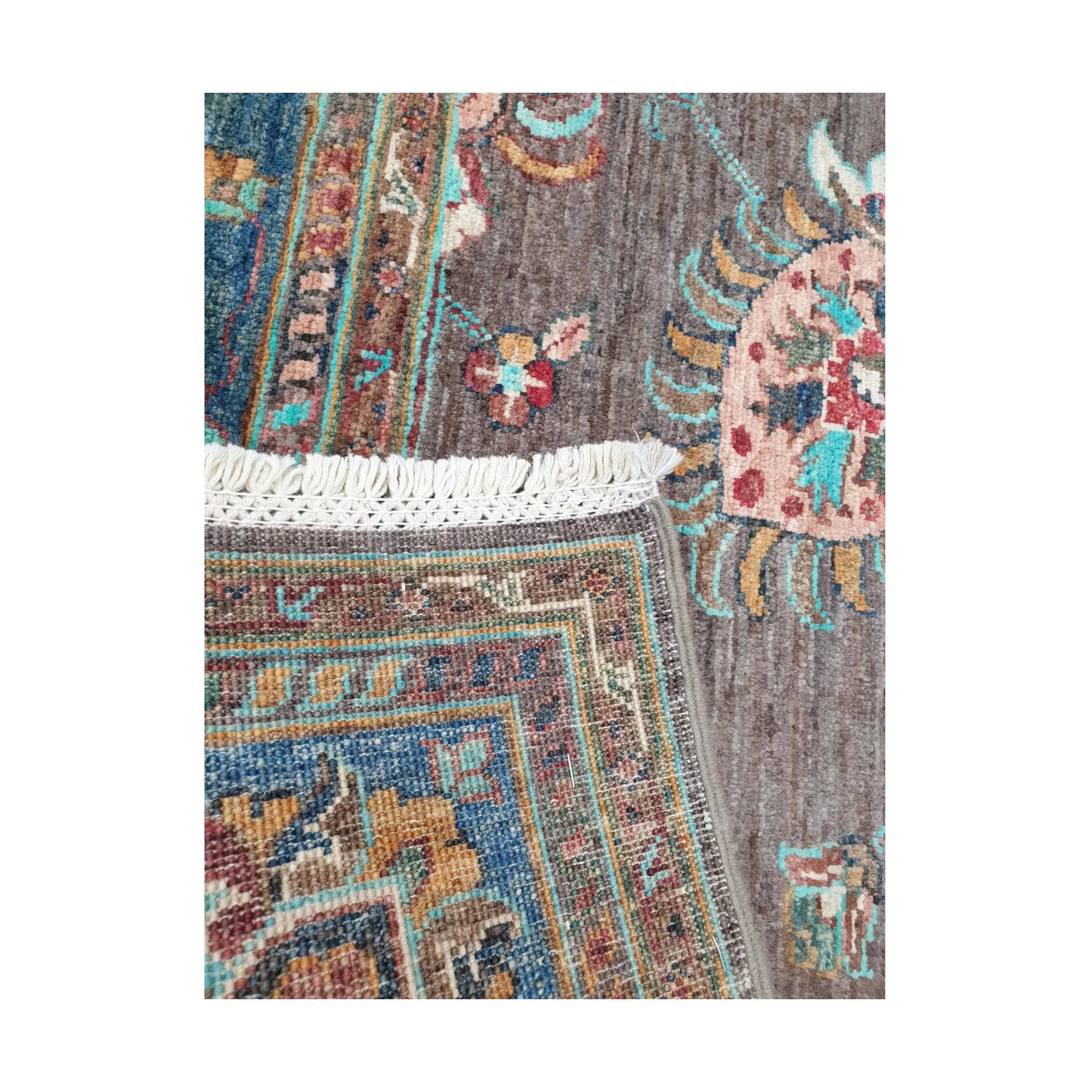 Fringe and weave detail of Afghan Sultani hand-knotted wool rug showing corner and reverse texture
