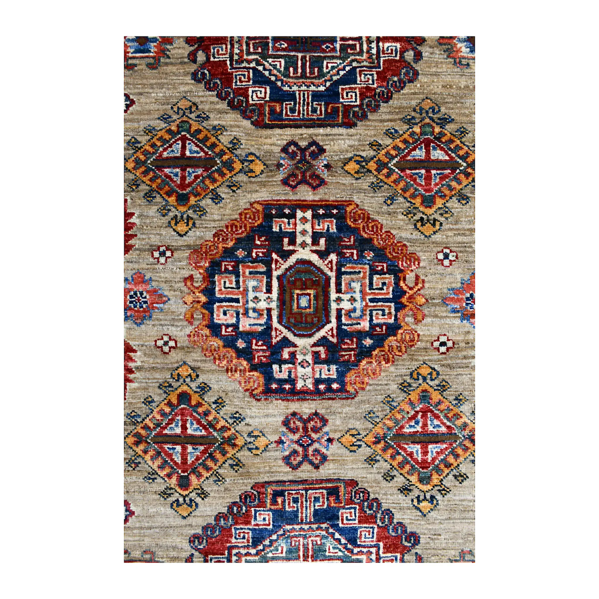 Central medallion detail of Super Kazak rug with deep navy stepped geometry, rust outline and ivory accents