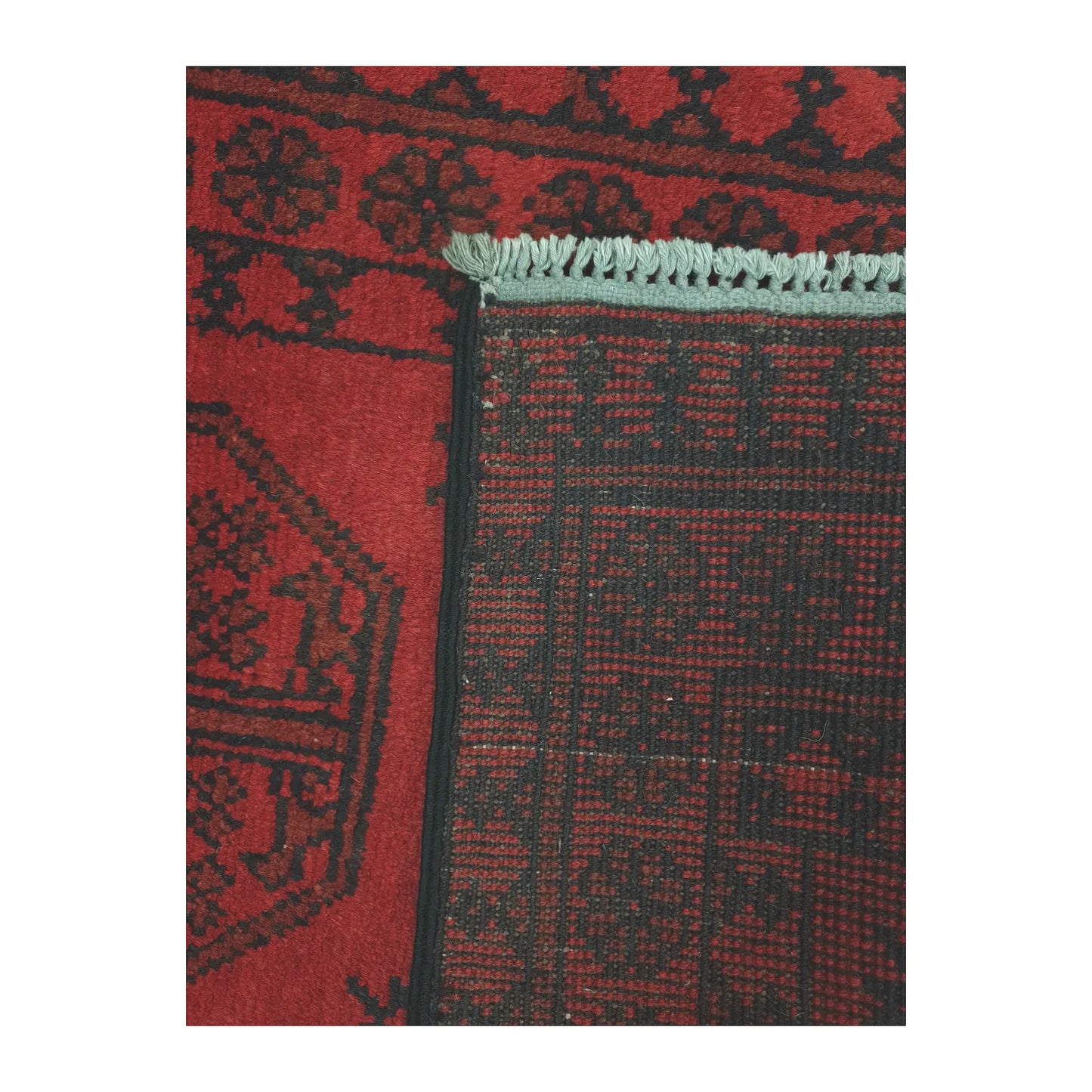 Reverse-weave and fringe detail of Afghan Turkoman wool runner rug showing back structure and hand-knotted pattern