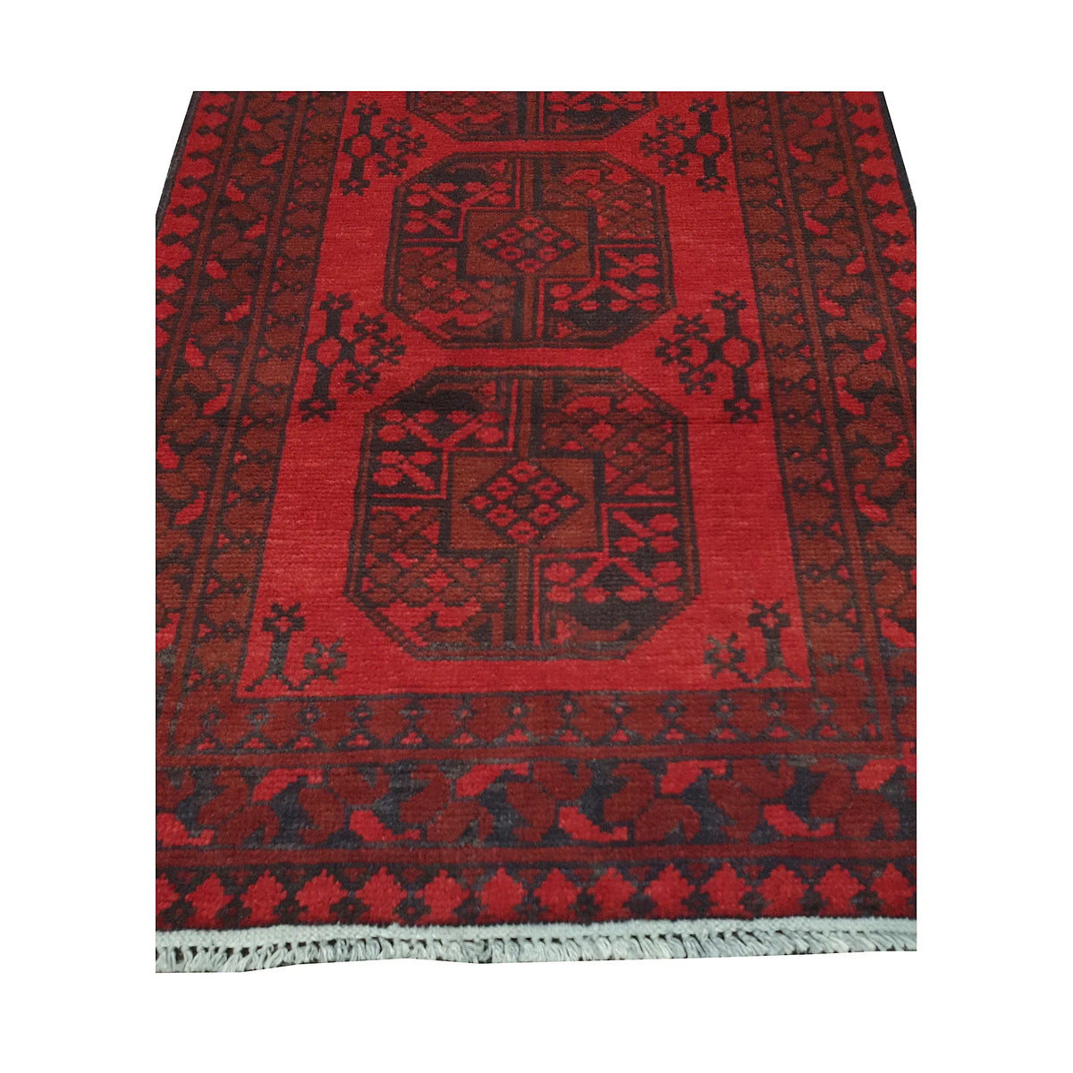 End field and fringe detail of Afghan Turkoman rug with red gul panel and charcoal tribal border pattern