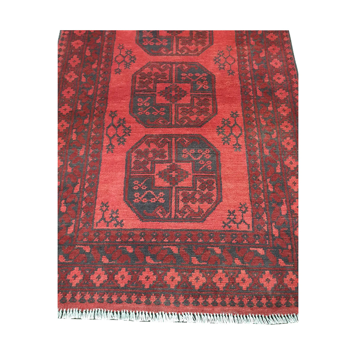 End field and fringe detail of Afghan Turkoman rug with red gul panel and charcoal border pattern