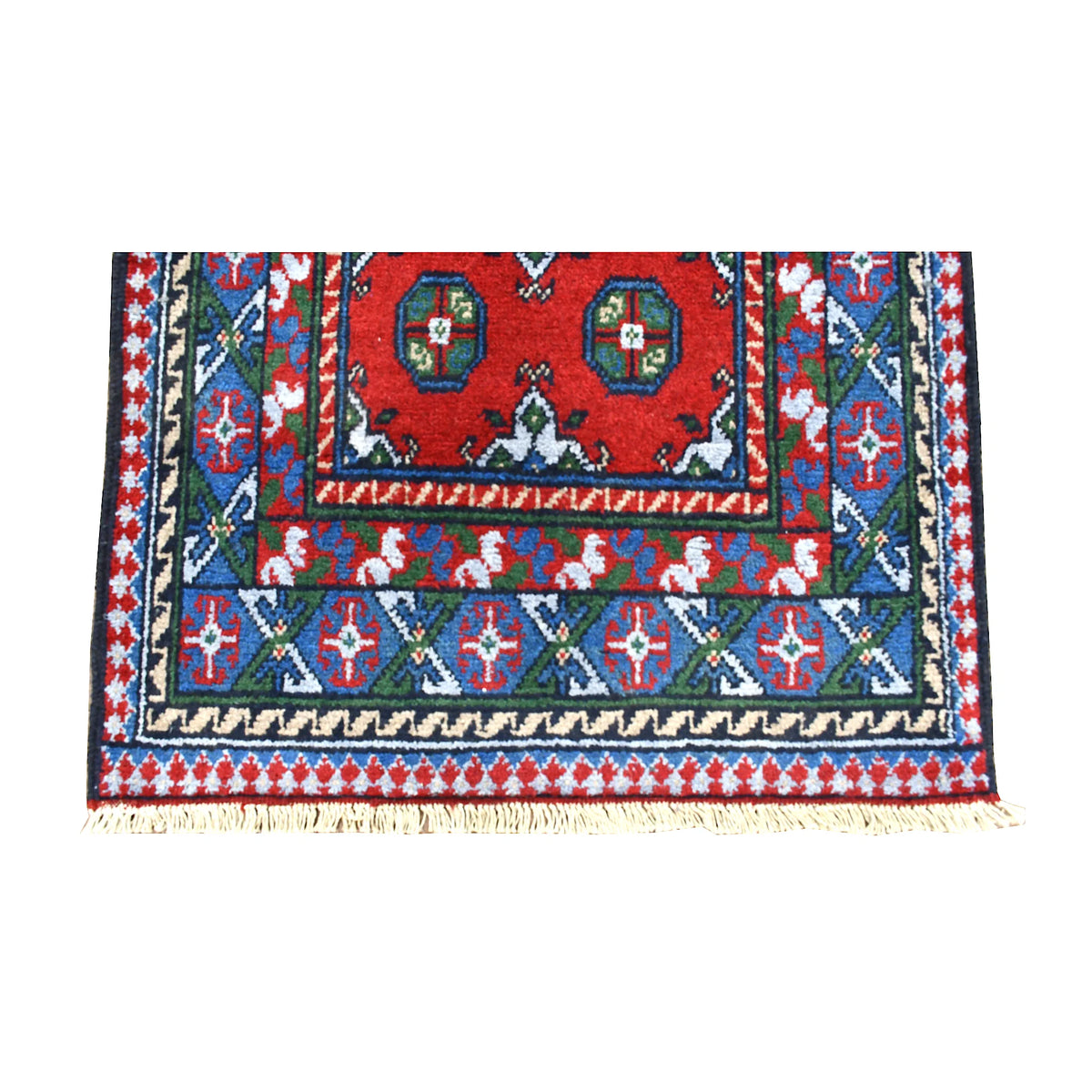 Fringe-end detail of Afghan Turkoman runner showing layered navy, teal, purple and ivory borders around the red field