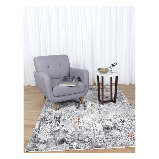 Almeras A4 grey abstract modern designer rug styled with grey armchair