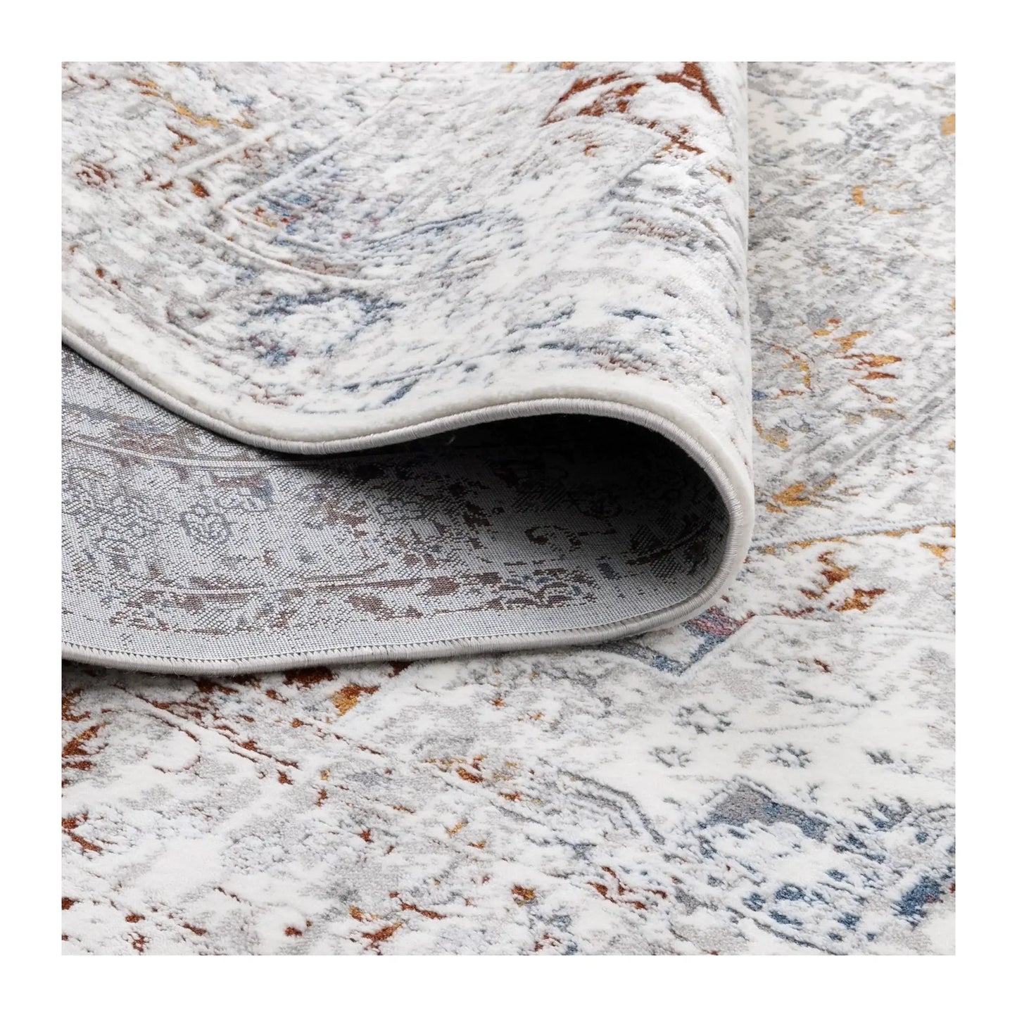 Rolled edge detail of Bohemian Paradise grey multi rug showing surface texture and pile