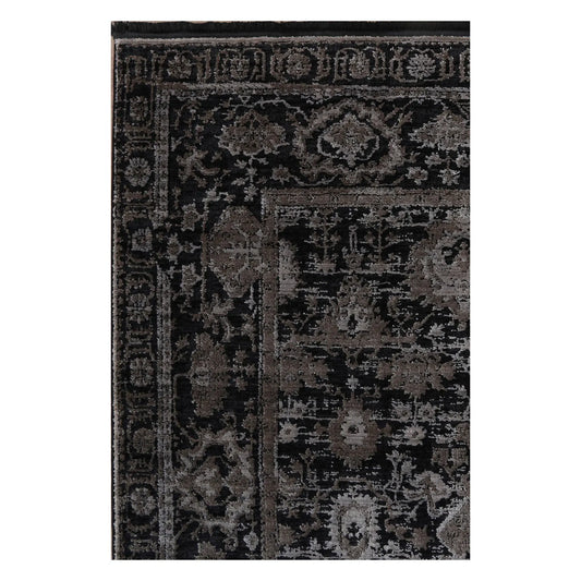 Close view of the raised pewter floral pattern, charcoal field and layered border detail