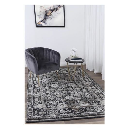 Brooklyn 300 pewter ornate rug styled with charcoal chair and side table