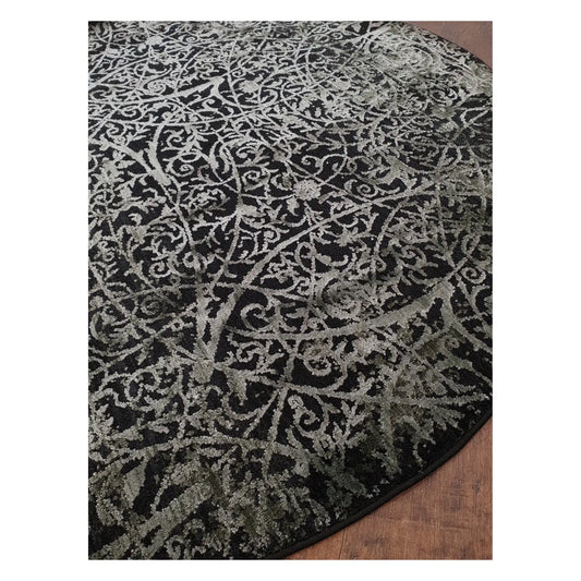 Angled detail of emerald and charcoal round rug showing scroll pattern and edge finish, 160 cm