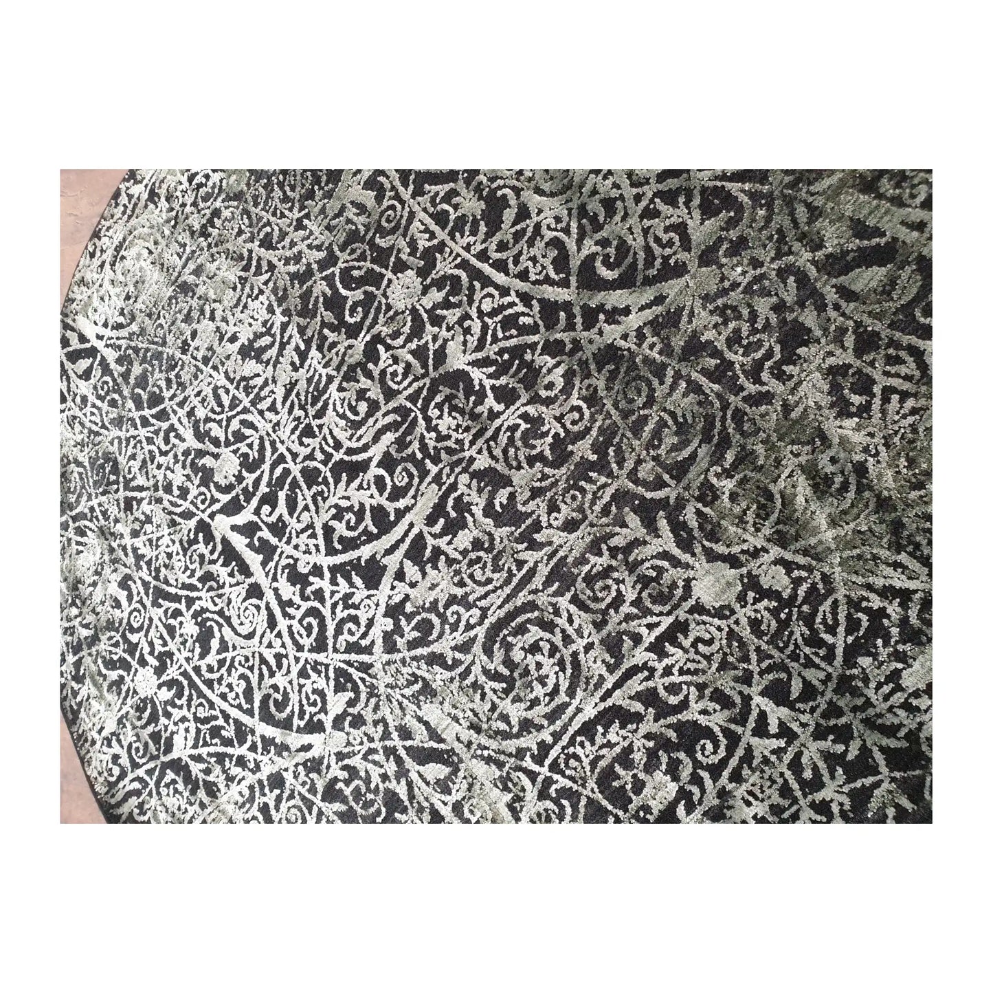 Close-up of Brooklyn round rug with emerald, charcoal, and silver botanical scroll design, 160 cm