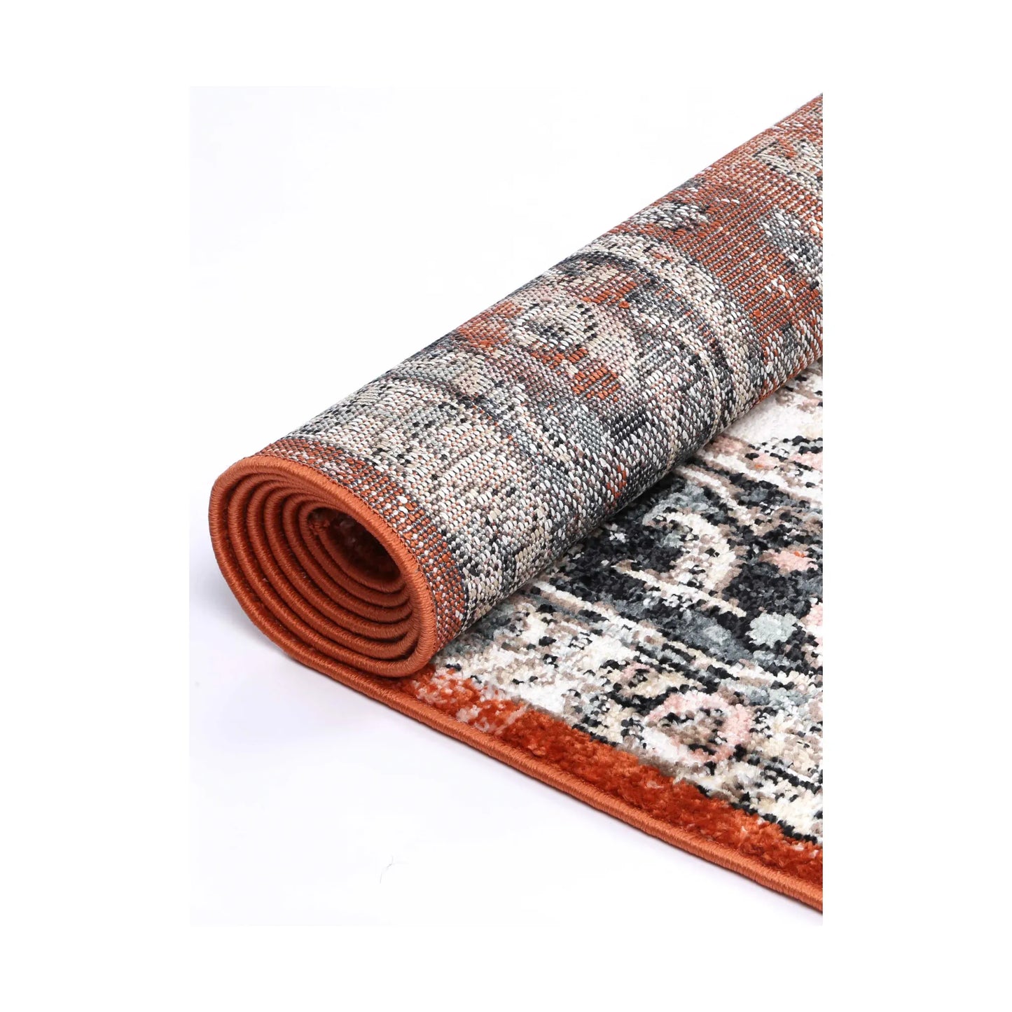 Rolled edge detail of Estate Terracotta transitional rug showing backing, binding and patterned polypropylene pile, 290 x 200 cm