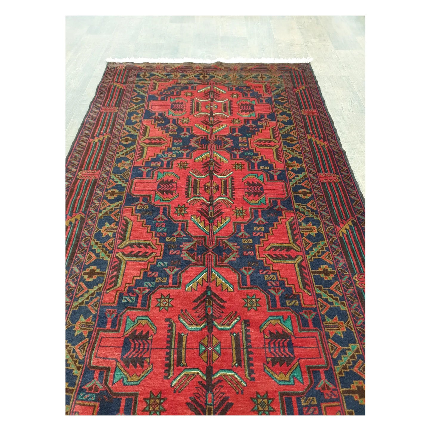 Field motif detail of Afghan Baluchi rug with red and dark blue tribal pattern