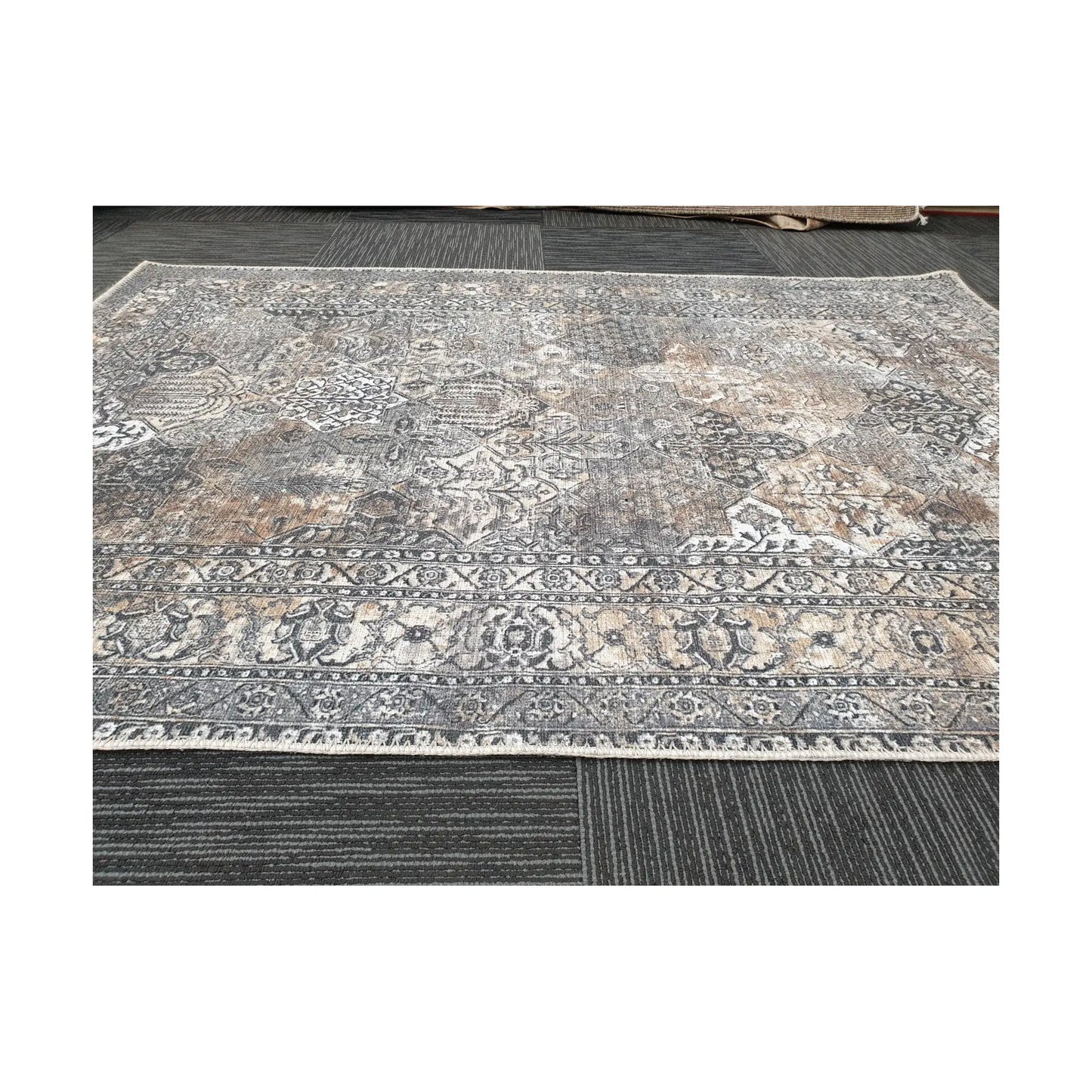 Close-up of grey silver cotton rug border pattern and faded vintage-style detail