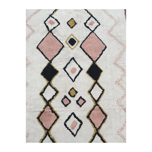 Pattern detail of Indian cotton white diamond rug showing pink, black and mustard diamond motifs