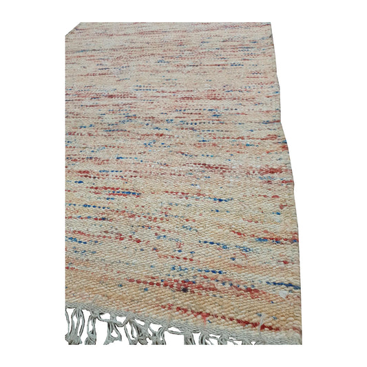 Fringe detail of Indian Dhurrie runner showing off-white flatweave with muted red, blue and ochre threads