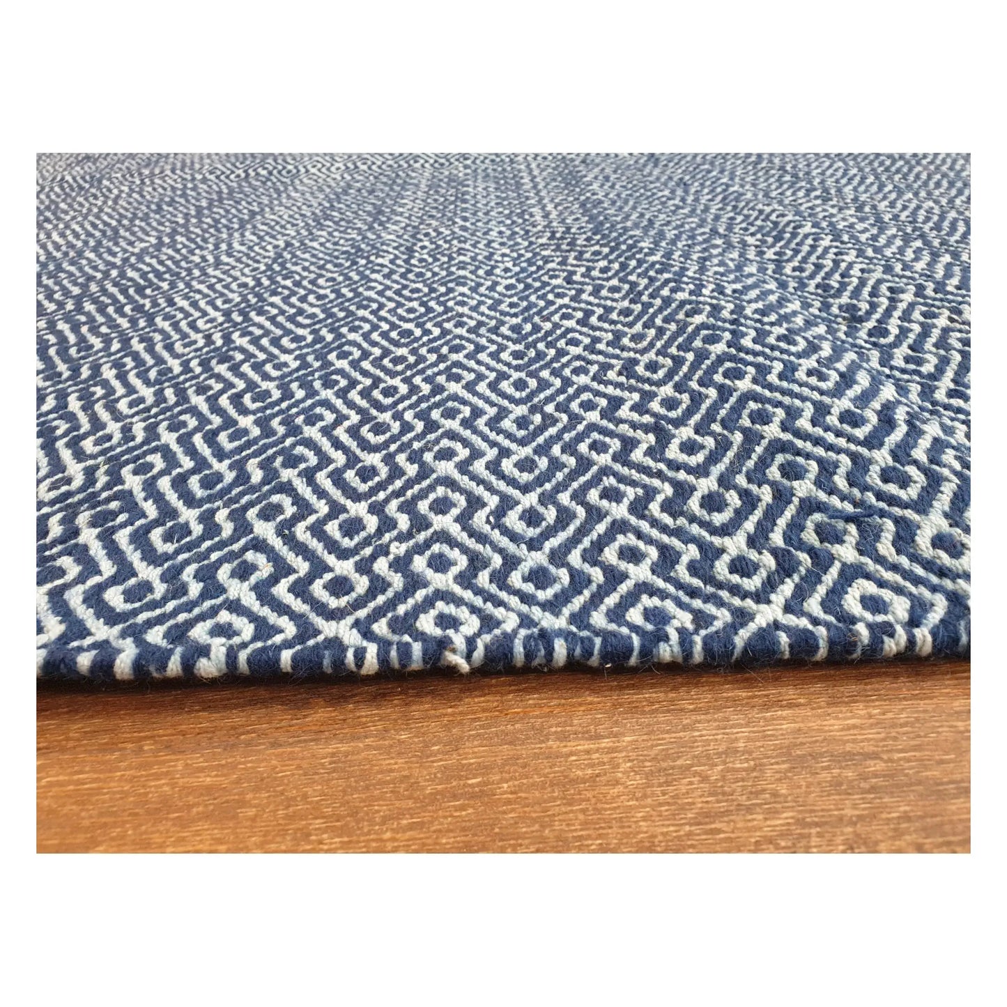 Low-angle close-up of Indian Dhurrie rug with blue geometric weave and flatweave texture, 230 x 160 cm