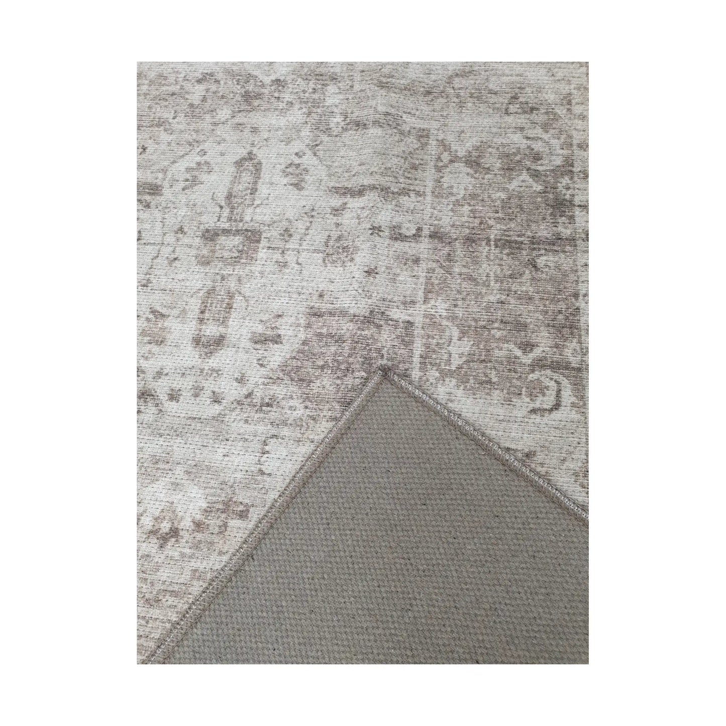 Close-up of ivory grey cotton rug corner with back and edge detail