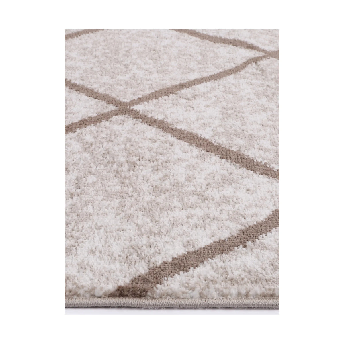 Edge detail of Kimberley 1 Trellis Latte rug showing heatset polypropylene pile, soft neutral tones and trellis pattern, 230 x 160 cm