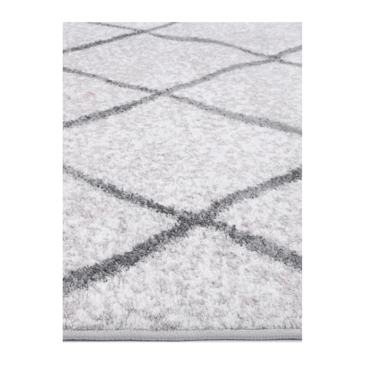 Close-up of Kimberley 1 Trellis Silver rug showing soft polypropylene pile and grey trellis pattern, 290 x 200 cm