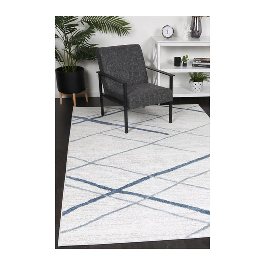 Kimberley 2 Blue Lattice rug styled with chair and indoor décor, showing modern blue white geometric design, 230 x 160 cm