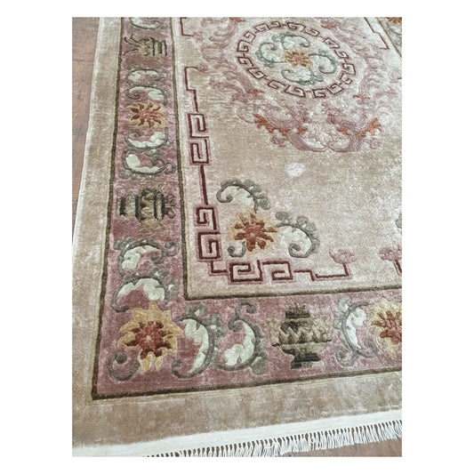 Border and corner detail of vintage Chinese silk rug with floral and geometric motifs
