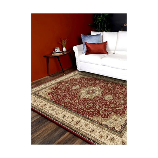 Styled room view of the Turkish Isfahan red medallion rug beside a white sofa on dark timber flooring