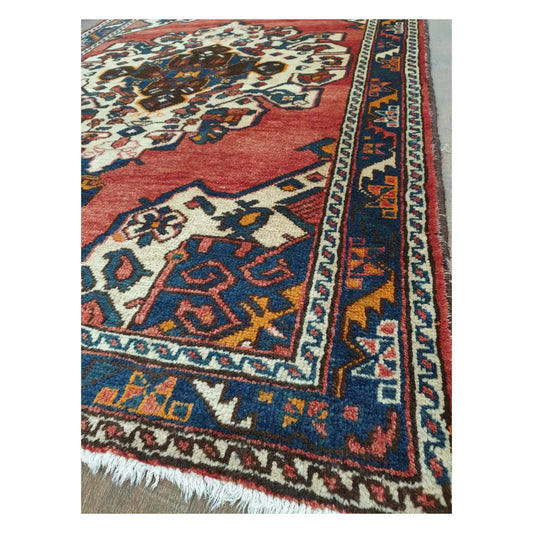 Border and fringe detail of vintage Persian Hamadan wool rug with multi-colour pattern