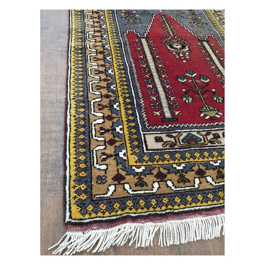 Border and fringe detail of a vintage Turkish Kula rug showing hand-knotted wool texture and geometric motifs