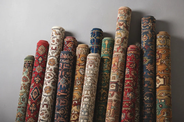 New arrival rugs displayed in varied roll thickness showing multiple handmade designs and colours